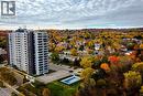 High-rise building featuring a contrasting façade with white siding and dark panels - 2055 Upper Middle Road Unit# 602, Burlington, ON 