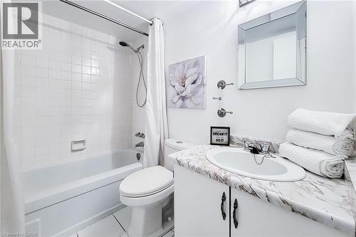 White tiled shower and bathtub combination - 2055 Upper Middle Road Unit# 602, Burlington, ON 