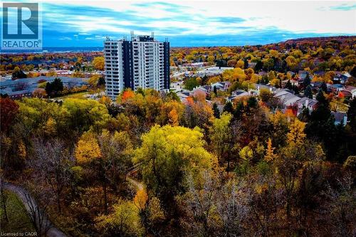 High-rise residential building featuring a dark facade with light-colored balconies - 2055 Upper Middle Road Unit# 602, Burlington, ON 