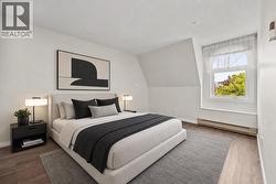 Virtually staged furnishings - primary bedroom - 