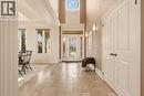Two-story foyer with transom window and sidelights, stone tile flooring, and double-door entryway - 15 Mcwilliams Court, Cambridge, ON  - Indoor Photo Showing Other Room 