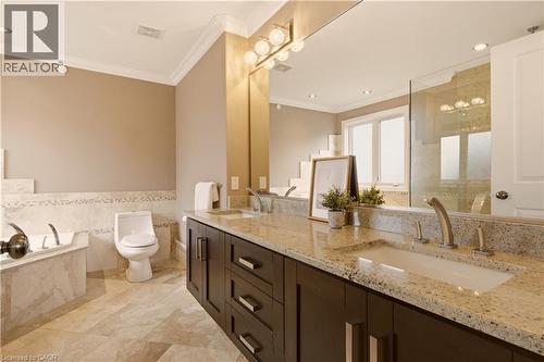 Dual vanity with integrated sinks and granite countertops - 15 Mcwilliams Court, Cambridge, ON - Indoor Photo Showing Bathroom