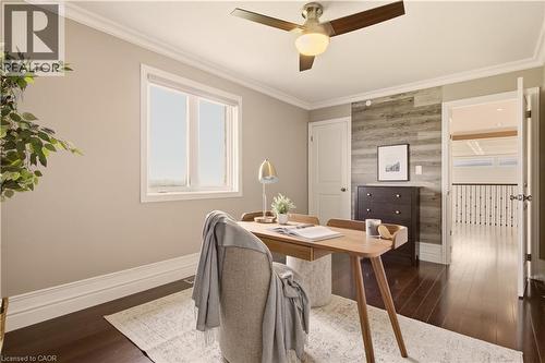 Room featuring wood-finish flooring, a ceiling fan with integrated lighting, and a window with white trim - 15 Mcwilliams Court, Cambridge, ON - Indoor