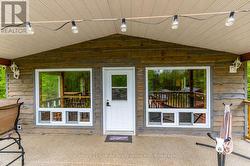 UPSTAIRS COVERED PORCH WITH SOLAR TWINKLE LIGHTS - 