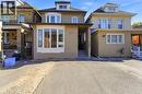 Brick facade residence featuring a prominent bay window, asphalt driveway, and covered entry - 968 Main Street E, Hamilton, ON  - Outdoor With Facade 