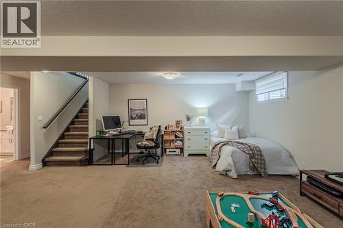 Carpeted lower level with a window, recessed ceiling lighting, and a neutral wall color - 15 Winterberry Lane, Waterford, ON 
