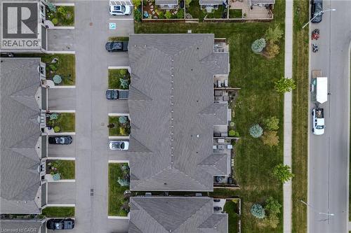 Townhome-style residences featuring gabled roofs and private outdoor patios - 15 Winterberry Lane, Waterford, ON 