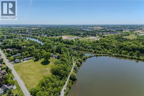 Expansive water frontage featuring a natural shoreline and mature trees - 15 Winterberry Lane, Waterford, ON 