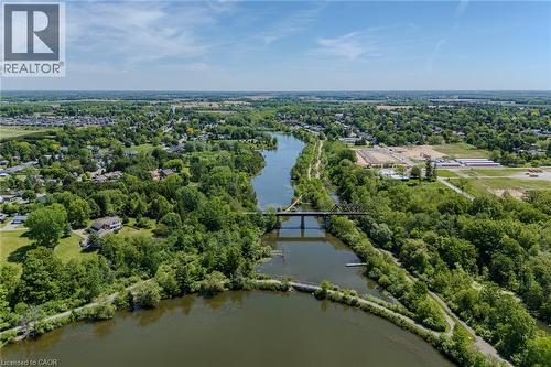Aerial perspective featuring a river, surrounding green spaces, and a bridge - 15 Winterberry Lane, Waterford, ON 