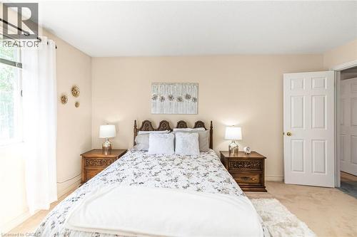 Bedroom featuring neutral-toned walls and carpet flooring - 85 Citation Crescent, Ancaster, ON 