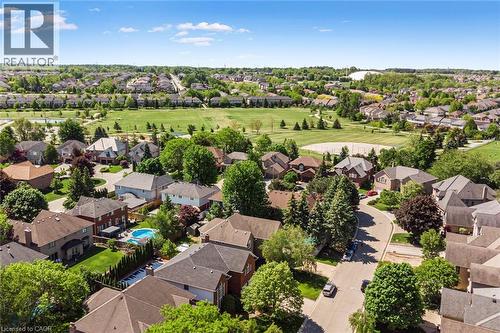 Aerial perspective showcasing a residential area with varied home styles and mature trees - 85 Citation Crescent, Ancaster, ON 