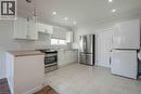 Kitchen featuring white cabinetry, light wood-finish countertops, stainless steel appliances, and recessed lighting - 204 Glow Avenue Unit# Upper, Hamilton, ON 
