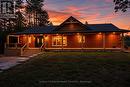 Hand Cut Log Home EVENING VIEW- AI Enhanced - 1007 Winding Creek Road, Minden Hills (Anson), ON 
