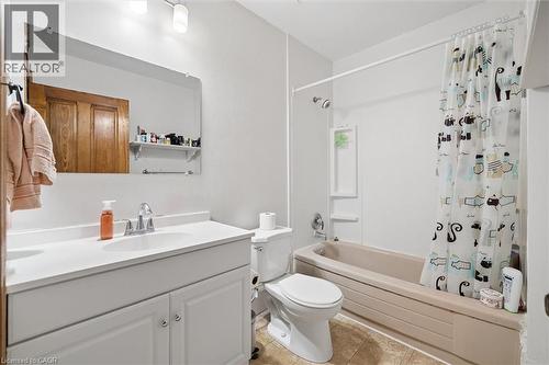 Bathroom featuring a single vanity with storage, an integrated sink, and a chrome faucet - 149 Young Street, Kitchener, ON - Indoor Photo Showing Bathroom