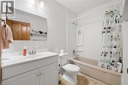 Bathroom featuring a single vanity with storage, an integrated sink, and a chrome faucet - 