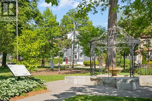 Grassy park setting featuring a decorative metal gazebo with a central fountain - 149 Young Street, Kitchener, ON - Outdoor