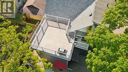 Expansive rooftop deck featuring composite decking and white railings - 