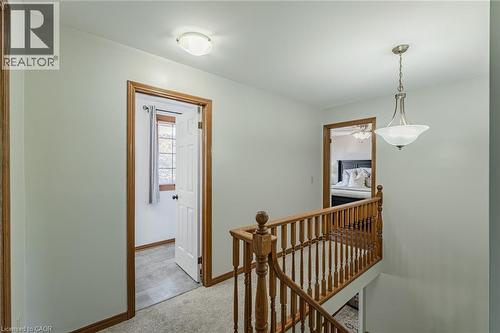 Upper-level hallway featuring light-colored walls and carpet flooring - 141 Lynndale Road, Simcoe, ON 
