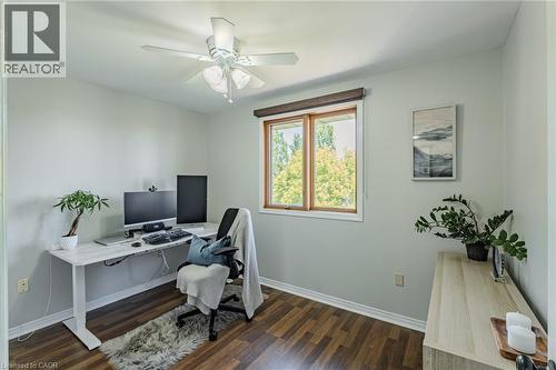 Room with wood-finish flooring, light-toned walls, and a ceiling fan with integrated lighting - 141 Lynndale Road, Simcoe, ON 