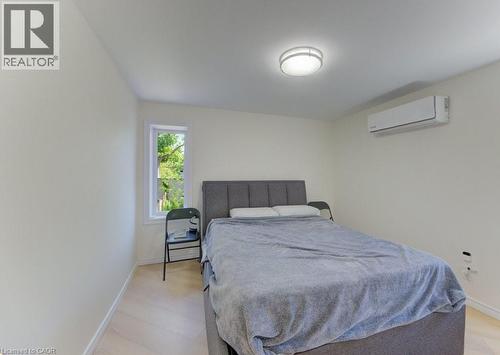 Bright interior space featuring light-toned walls and wood-finish flooring - 11 Davidson Street, Cambridge, ON 
