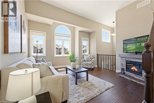 The fire in the fireplace is for visualization purposes only and it was not turned on at the time of the photo - 32 Sorrento Street, Kitchener, ON 