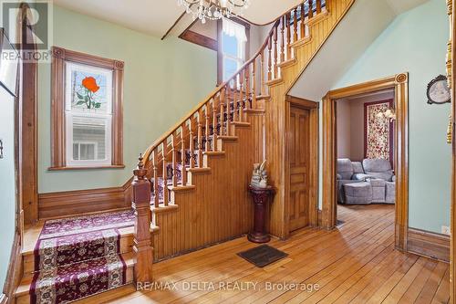 A beautiful staircase with a landing. - 132 High Street, Champlain, ON 
