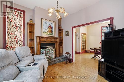 A wood-burning fireplace in the den. - 132 High Street, Champlain, ON 