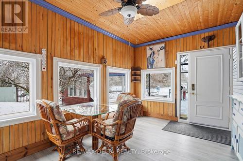 Sun room leads to rear deck. - 132 High Street, Champlain, ON 
