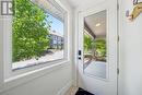Looking out entry door - 101 - 1 Tree Tops Lane, Huntsville (Chaffey), ON 