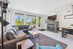 Living area with gas fireplace - walkout to patio - 