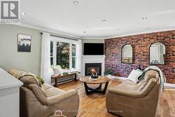 Open concept living room with gas fireplace - 