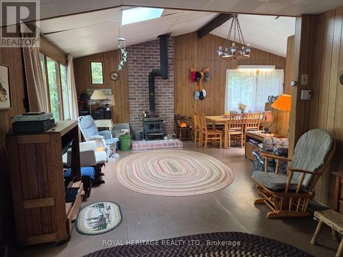**Large Living Room With Wood Stove** - 1160 Sunset Strip Lane, Frontenac, ON - Indoor With Fireplace
