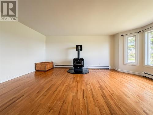 Living room with wood stove - 51-53 Creston Boulevard, Marystown, NL 