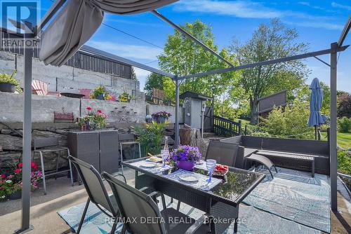 Patio table, outdoor bar storage. - 162 Front Road W, Champlain, ON 