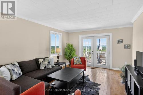Century farmhouse living room with walkout to deck - 794 Morton Line, Cavan Monaghan (Cavan Twp), ON 