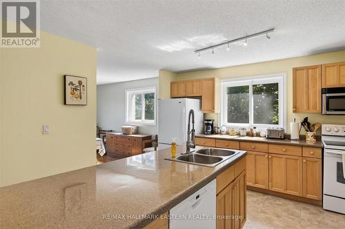 Century farmhouse kitchen with large centre island - 794 Morton Line, Cavan Monaghan (Cavan Twp), ON 