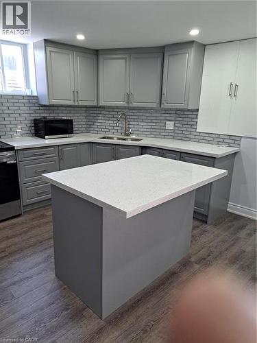 Kitchen island featuring a light-toned countertop - 2240 Headon Road Unit# Lower, Burlington, ON 