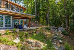 Lakeside of the cottage with wood fired hot tub - 