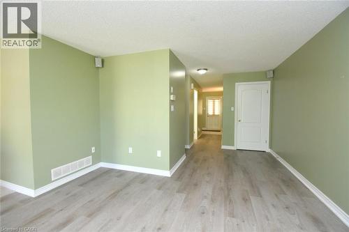 Open living space featuring wood-finish flooring and a neutral color palette - 2 Harbour Drive Unit# 17, Stoney Creek, ON 
