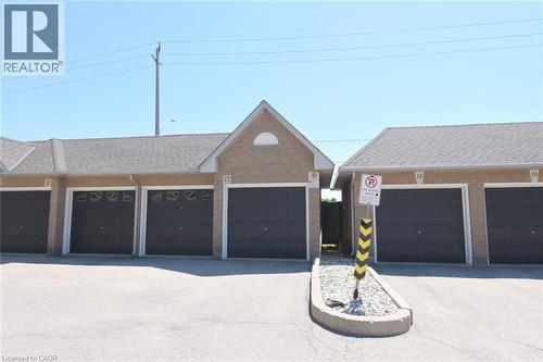Garage. Two doors to two bays, left from median. - 2 Harbour Drive Unit# 17, Stoney Creek, ON 