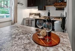 Prep island, with storage and breakfast bar. - 