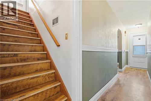 Stairs with wood finished floors and arched walkways - 549 Weber Street E, Kitchener, ON 