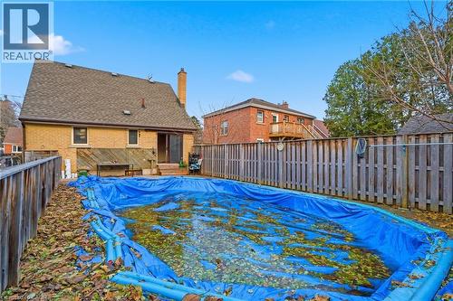 View of swimming pool with a fenced backyard and a wooden deck - 549 Weber Street E, Kitchener, ON 