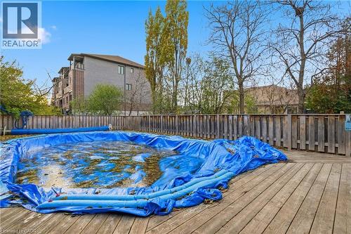 View of pool featuring a wooden deck and a fenced backyard - 549 Weber Street E, Kitchener, ON 