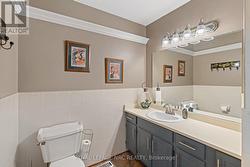 Main floor bathroom has a linen closet. - 