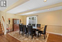 Large dining room with hardwood floor - 