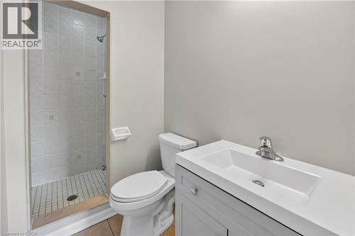 Light gray painted walls complementing a white vanity with an integrated sink and chrome faucet - 7 Hepworth Crescent, Ancaster, ON 