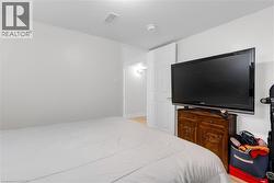 Neutral-toned walls complement wood-finish flooring - 