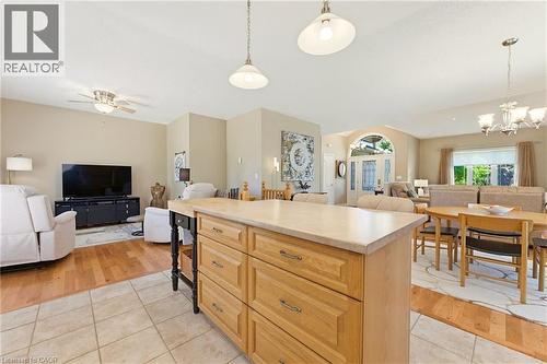 Central kitchen island with ample drawer storage and a light-toned countertop - 5 Coastal Court, Port Dover, ON 