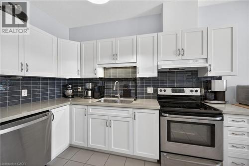 Pop of colour in these fabulous subway tiles! - 6 Gaddye Lane, Binbrook, ON - Indoor Photo Showing Kitchen